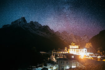 Night Sky with Stars Over Mountain Village and Temple