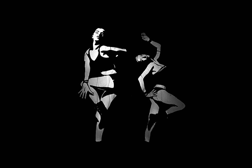 High Contrast Black and White Silhouette of Two Dancers