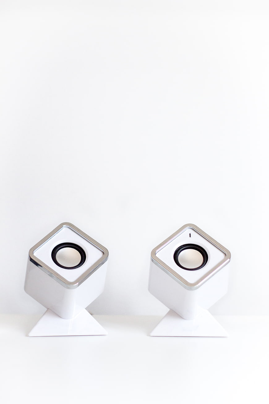 Minimalist White Cube Speakers on White Background