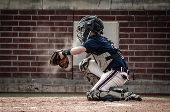 Youth Baseball Catcher in Action on Dirt Field