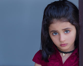 Portrait of a young girl with a serious expression