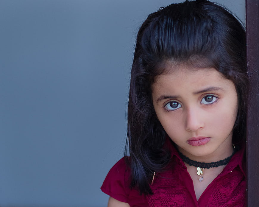 Portrait of a young girl with a serious expression