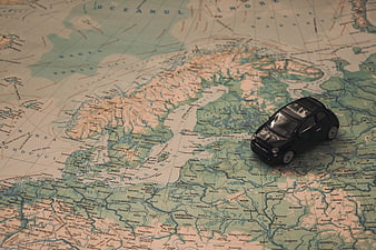 Toy car on vintage map of Scandinavia and Europe