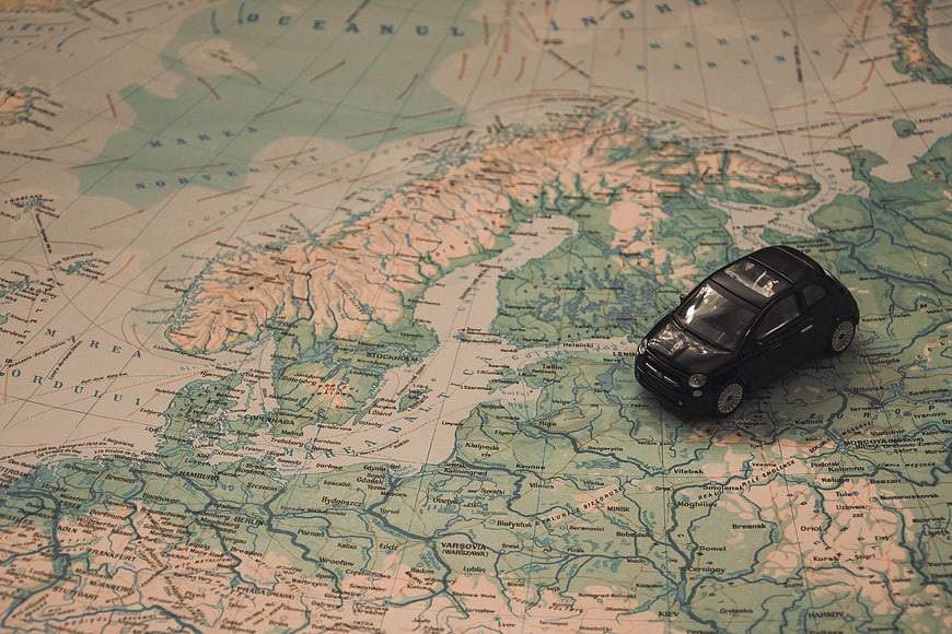Toy car on vintage map of Scandinavia and Europe