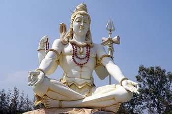 White Statue of Lord Shiva Meditating with Trishul