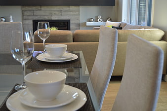 Modern Dining Room with White Tableware and Beige Sofa