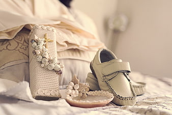Baby Baptism Shoes and Cross on Bed