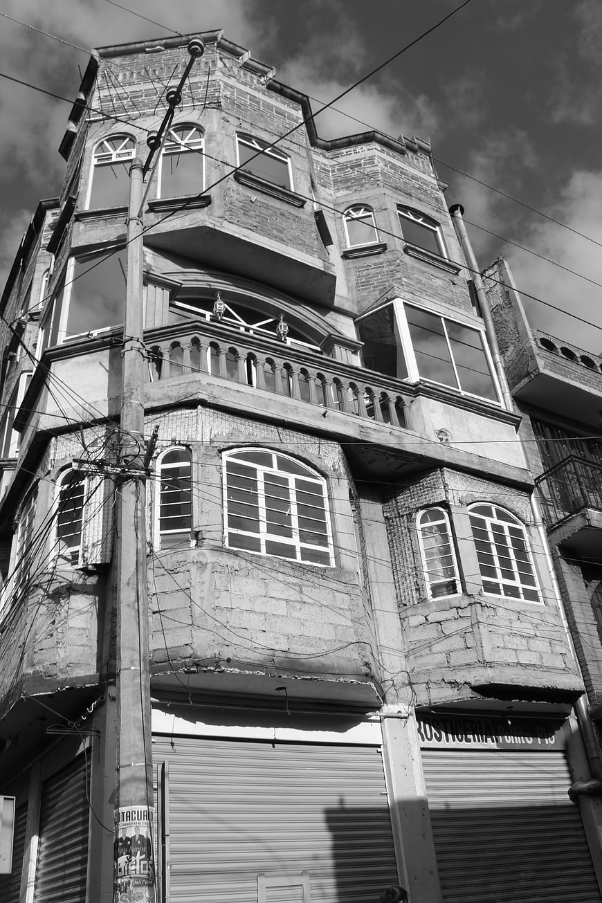 Black and white low angle view of old brick building