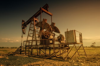 Rusty Oil Pump Jack in Golden Hour Countryside
