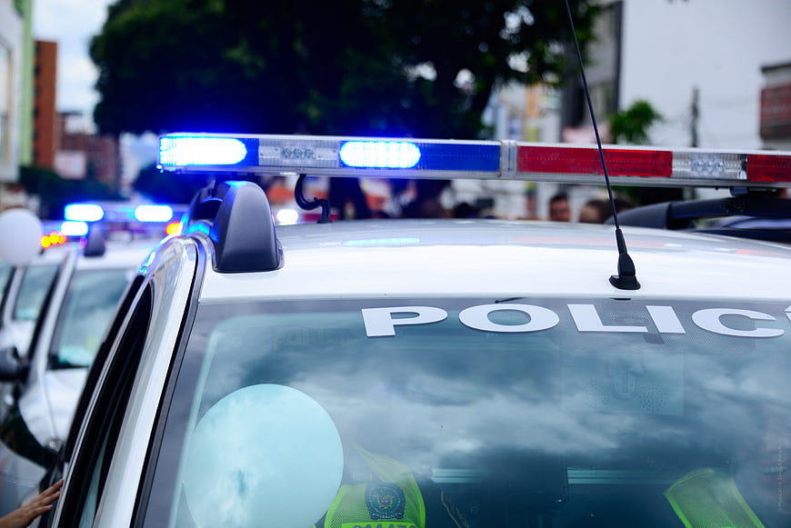 Close-up of police car with flashing blue emergency lights