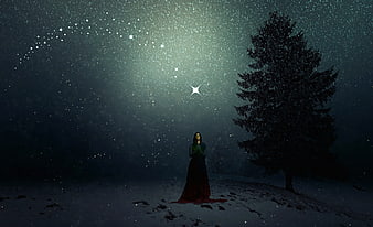 Woman Praying in Snowy Night Landscape Under Starry Sky