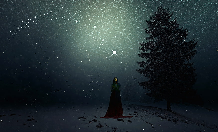 Woman Praying in Snowy Night Landscape Under Starry Sky