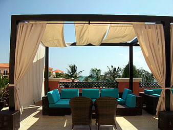 Luxury Outdoor Patio with Turquoise Sofa and Ocean View