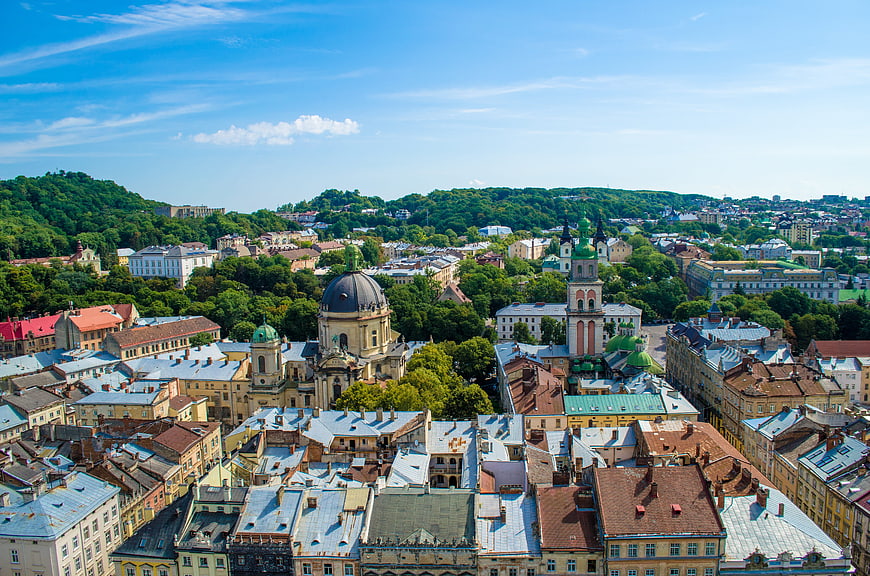 Aerial View of Lviv Cityscape with Historic Architecture and Green Hills