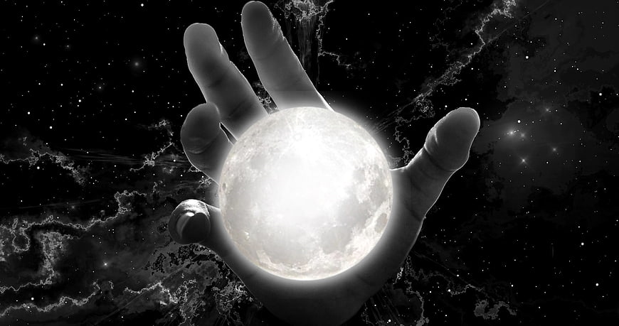 Hand Holding Glowing Moon in Starry Space Background