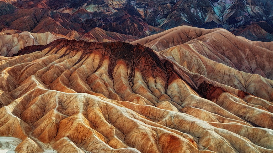 Colorful eroded badlands landscape with layered rock formations
