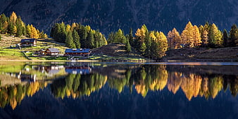 Alpine Mountain Lake With Autumn Reflections And Chalets