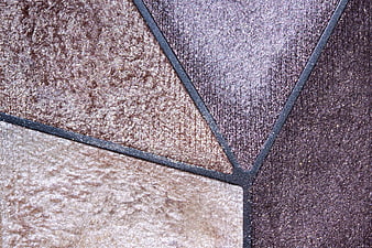 Close-up of textured brown and purple fabric swatches