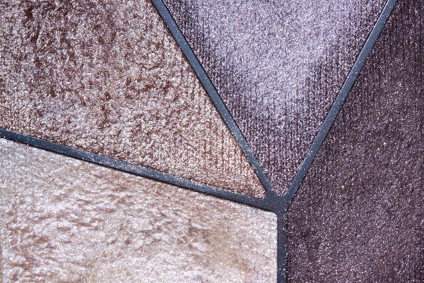 Close-up of textured brown and purple fabric swatches