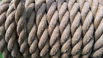 Close-up texture of thick twisted natural fiber rope