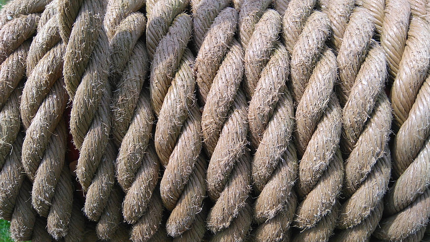Close-up texture of thick twisted natural fiber rope