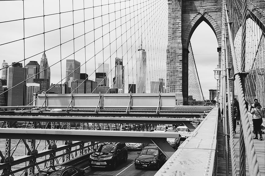 Black and white view of Manhattan skyline from Brooklyn Bridge