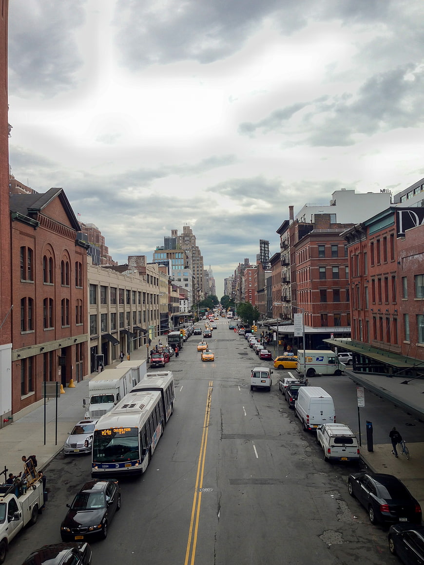 Urban Street Scene with Traffic and Brick Buildings