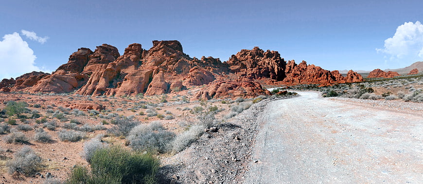 Panoramic View of Red Rock Desert Landscape with Dirt Road