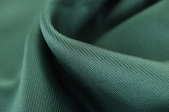 Macro Close-Up Of Green Woven Cotton Fabric Texture