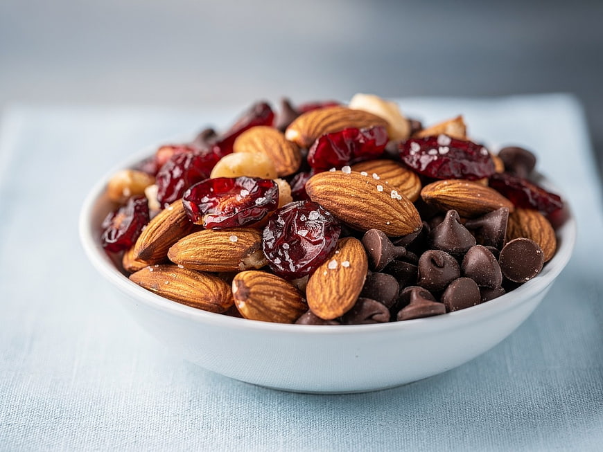 Bowl of almonds, dried cranberries, and chocolate chips