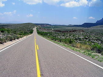 Desert Highway Stretching Through Arid Landscape