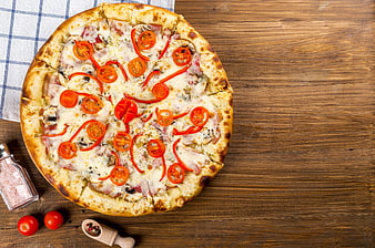 Homemade Margherita Pizza With Cherry Tomatoes On Rustic Wooden Table