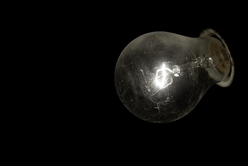 Vintage Light Bulb on Black Background