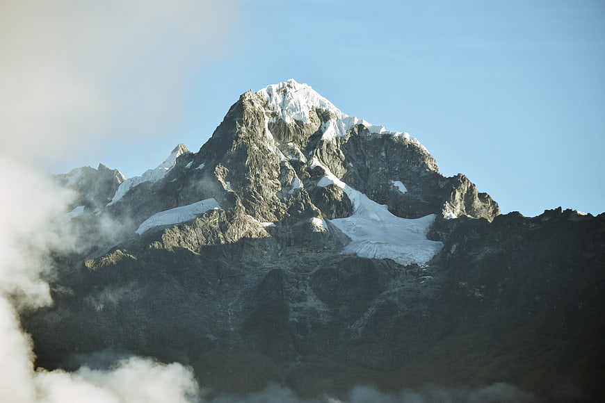 Majestic Snow-Capped Mountain Peak with Clouds