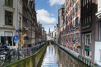 Amsterdam canal with historic buildings and bicycles