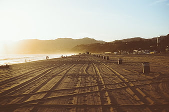 Golden Hour Beach Tracks with Ocean and Mountains