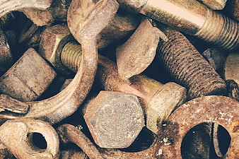 Close-up of rusty bolts, nuts, and metal hardware