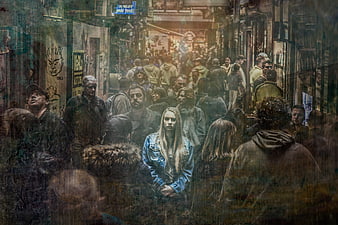 Lonely woman in denim jacket standing in crowded urban street