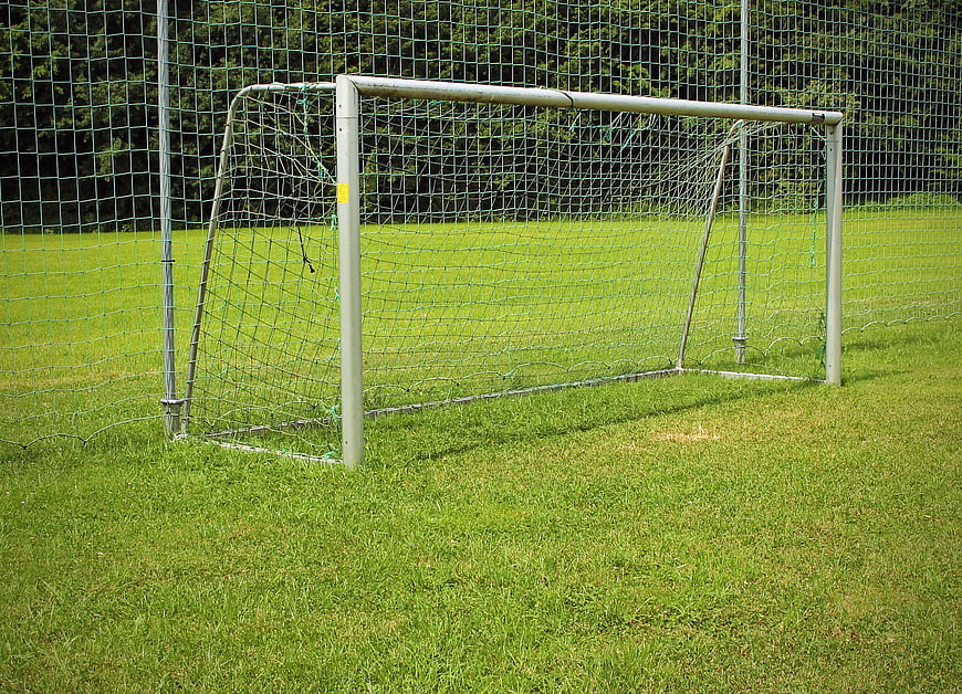 Empty Soccer Goal On Green Grass Field