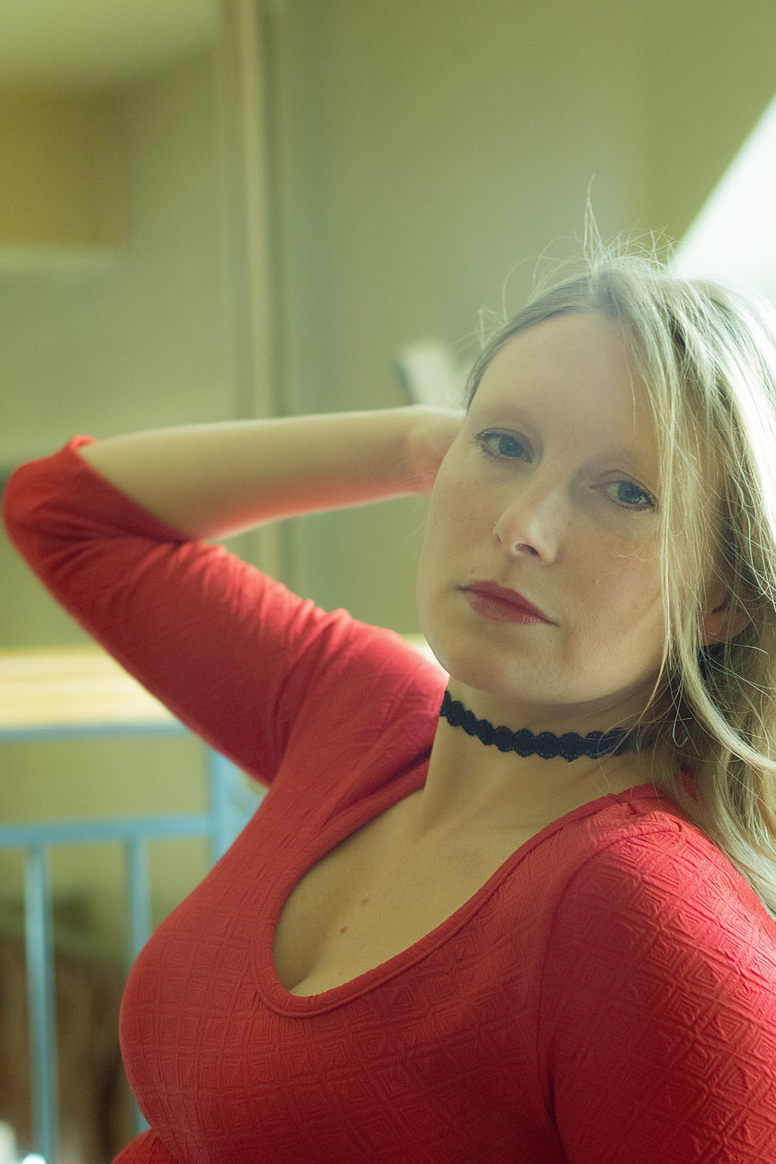 Blonde Woman in Red Top with Black Choker Portrait