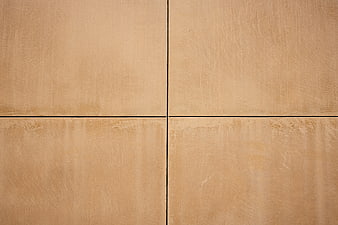 Beige textured wall tiles with geometric grid pattern background