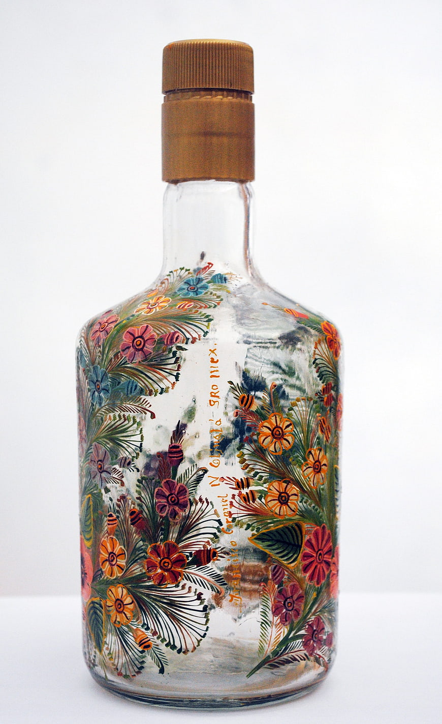 Hand-painted glass bottle with floral design and bees