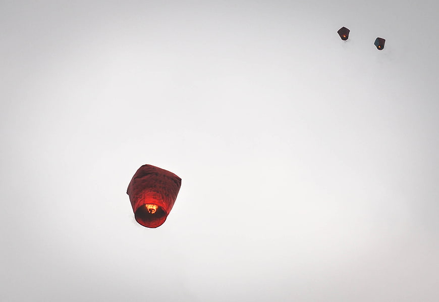 Red Sky Lanterns Floating in White Sky