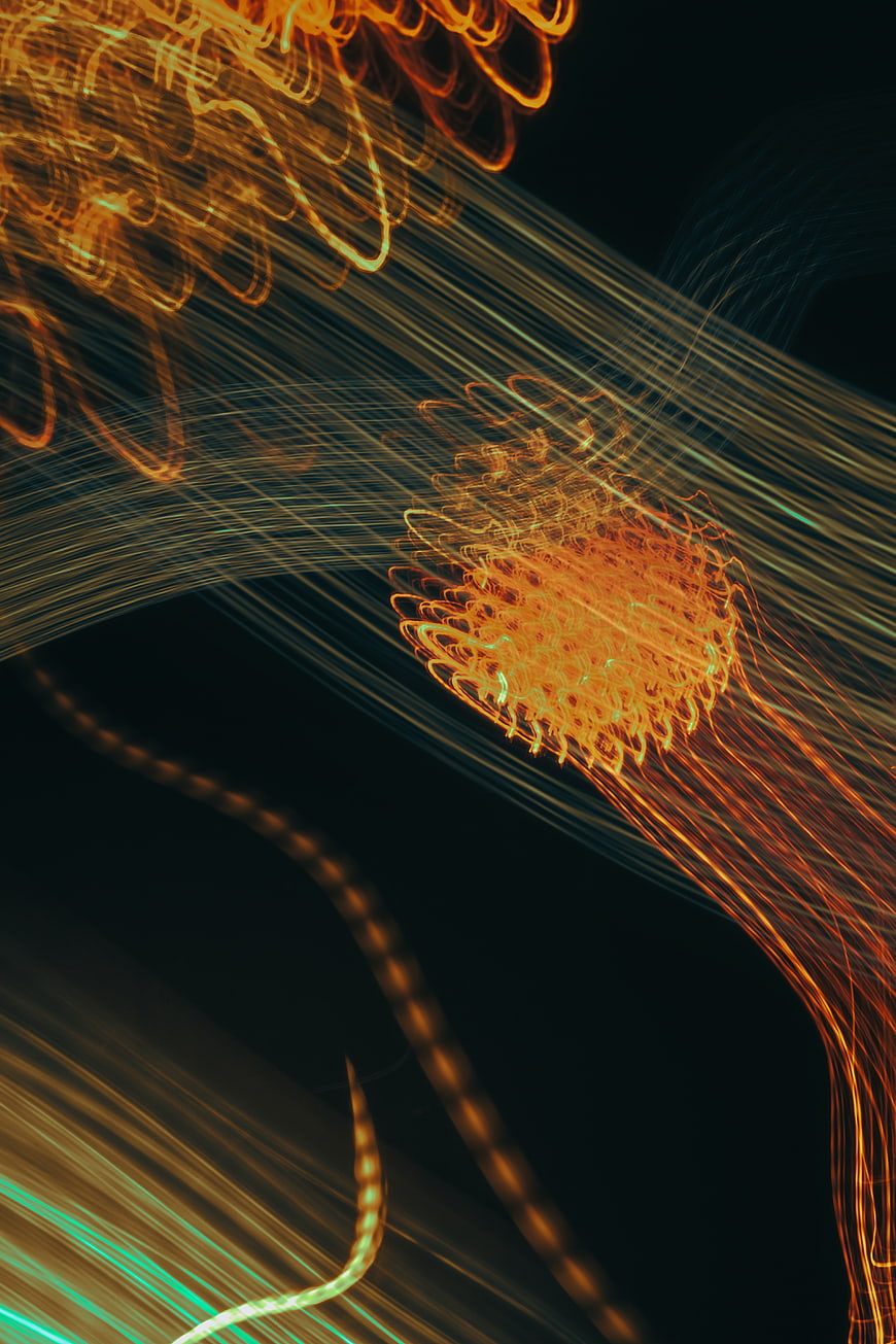 Abstract Light Painting with Orange and Green Streaks