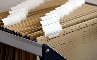 Close-up of hanging file folders in an office cabinet