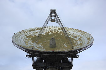 Large Soviet Radio Telescope Dish Antenna Against Overcast Sky