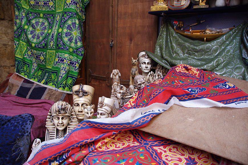 Egyptian souvenirs and colorful textiles in a market stall