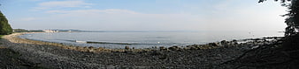 Panoramic view of rocky Baltic Sea coastline with calm waters