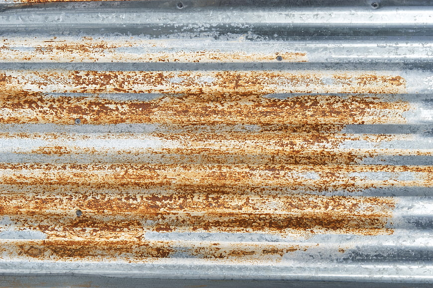 Rusted corrugated metal sheet texture background