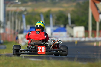 Rear view of go-kart number 28 on a race track